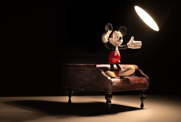 mickey figure posed on piano figure