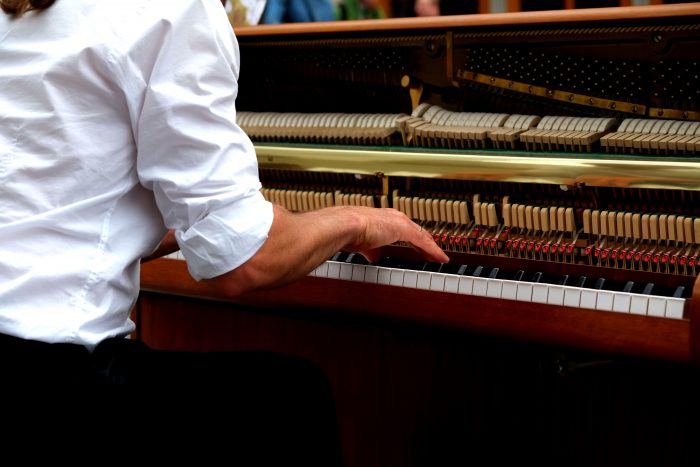 piano with open strings and hammers