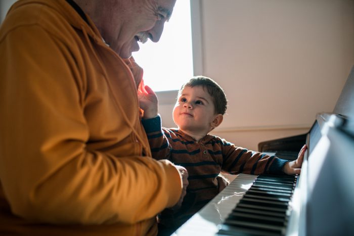 baby and grandpa at piano